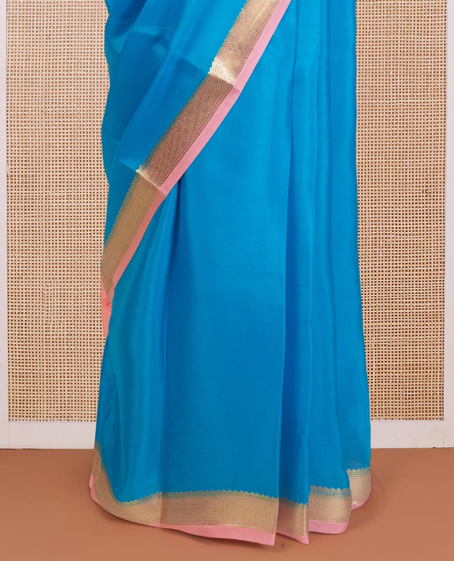 Aszure blue plain Mysore silk saree, contrast traditional zari border, and zari striped pallu