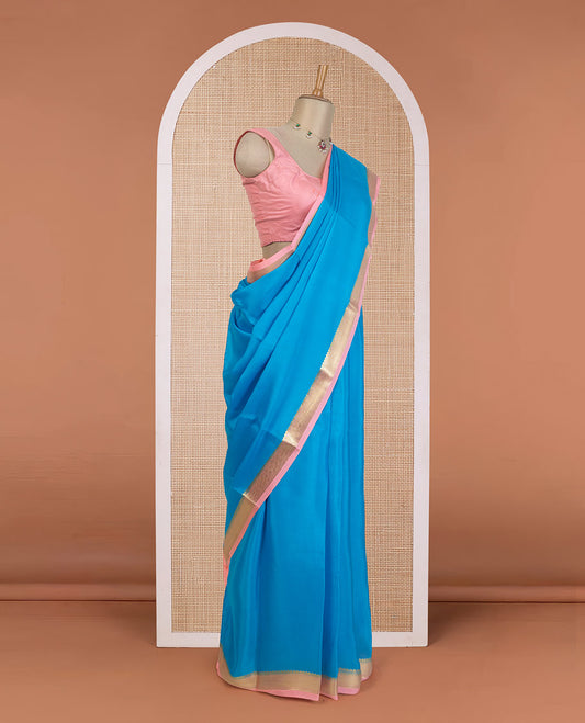 Aszure blue plain Mysore silk saree, contrast traditional zari border, and zari striped pallu
