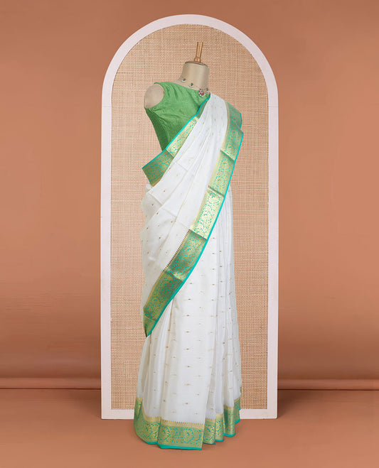 Cream zari buttas Mysore silk saree, contrast floral creeper zari border, and floral jaal pallu