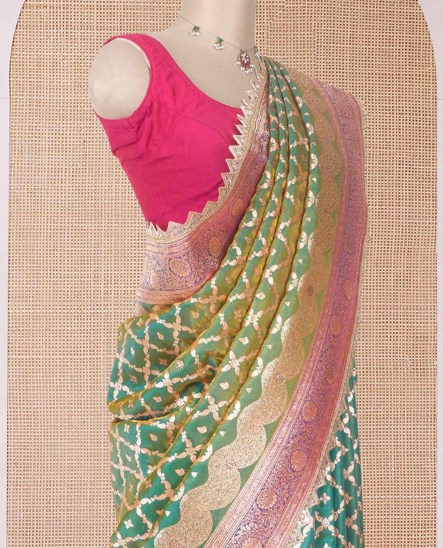 Green jaal jacquard with micro stonework banaras nylon silk saree, contrast floral creeper zari and stone work border, and intricately zari woven pallu