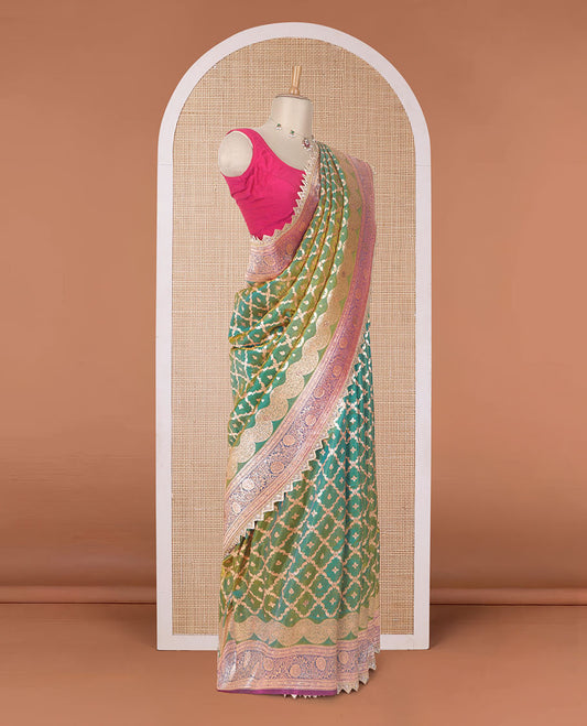 Green jaal jacquard with micro stonework banaras nylon silk saree, contrast floral creeper zari and stone work border, and intricately zari woven pallu
