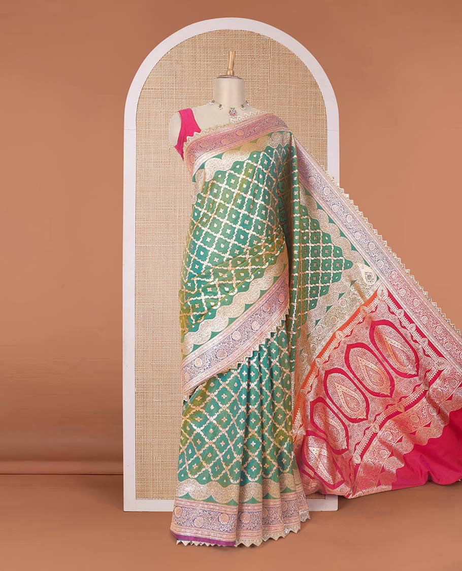 Green jaal jacquard with micro stonework banaras nylon silk saree, contrast floral creeper zari and stone work border, and intricately zari woven pallu