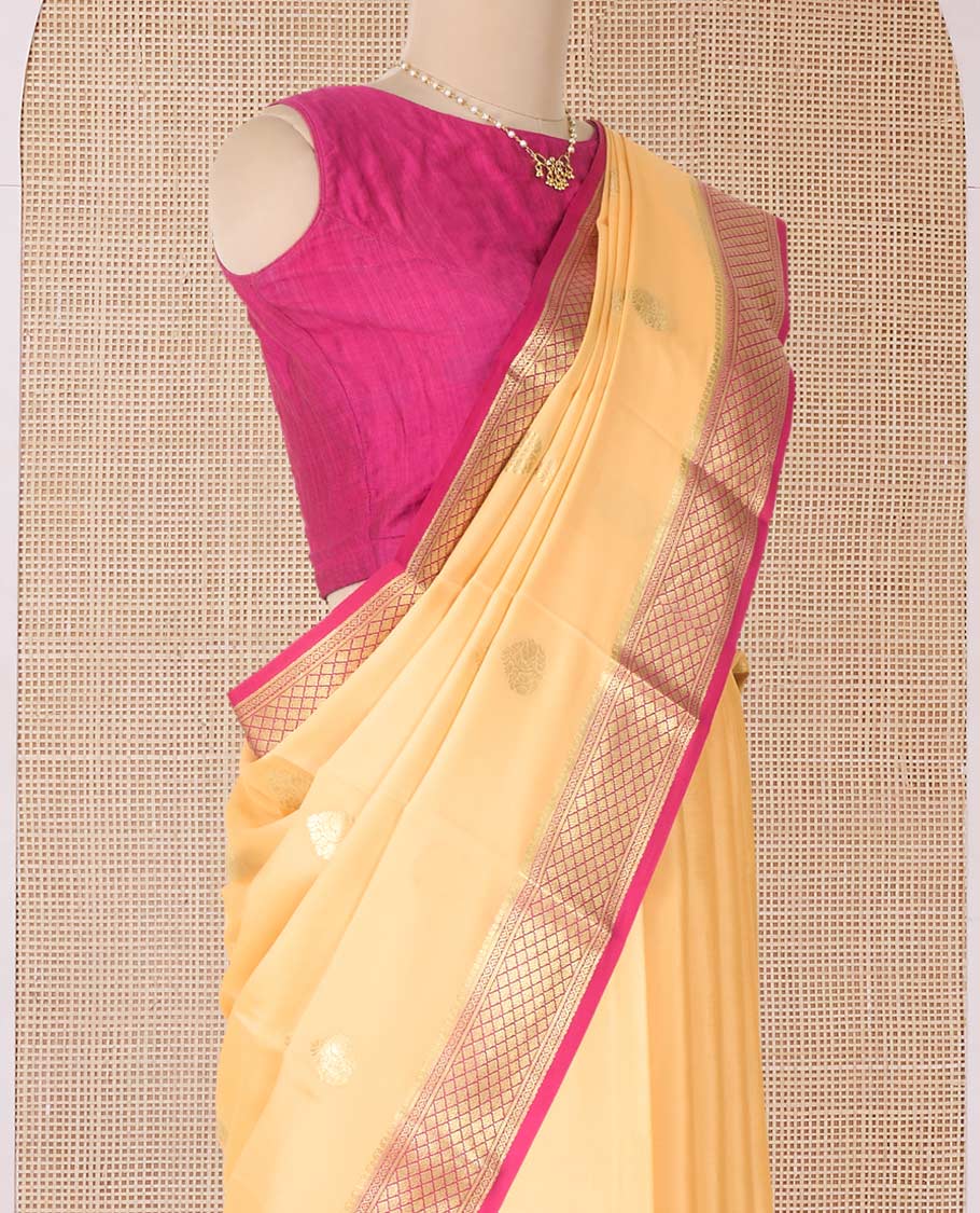 Yellow zari buttas Mysore silk saree, contrast jaal zari border, and pallu of floral creeper design in zari