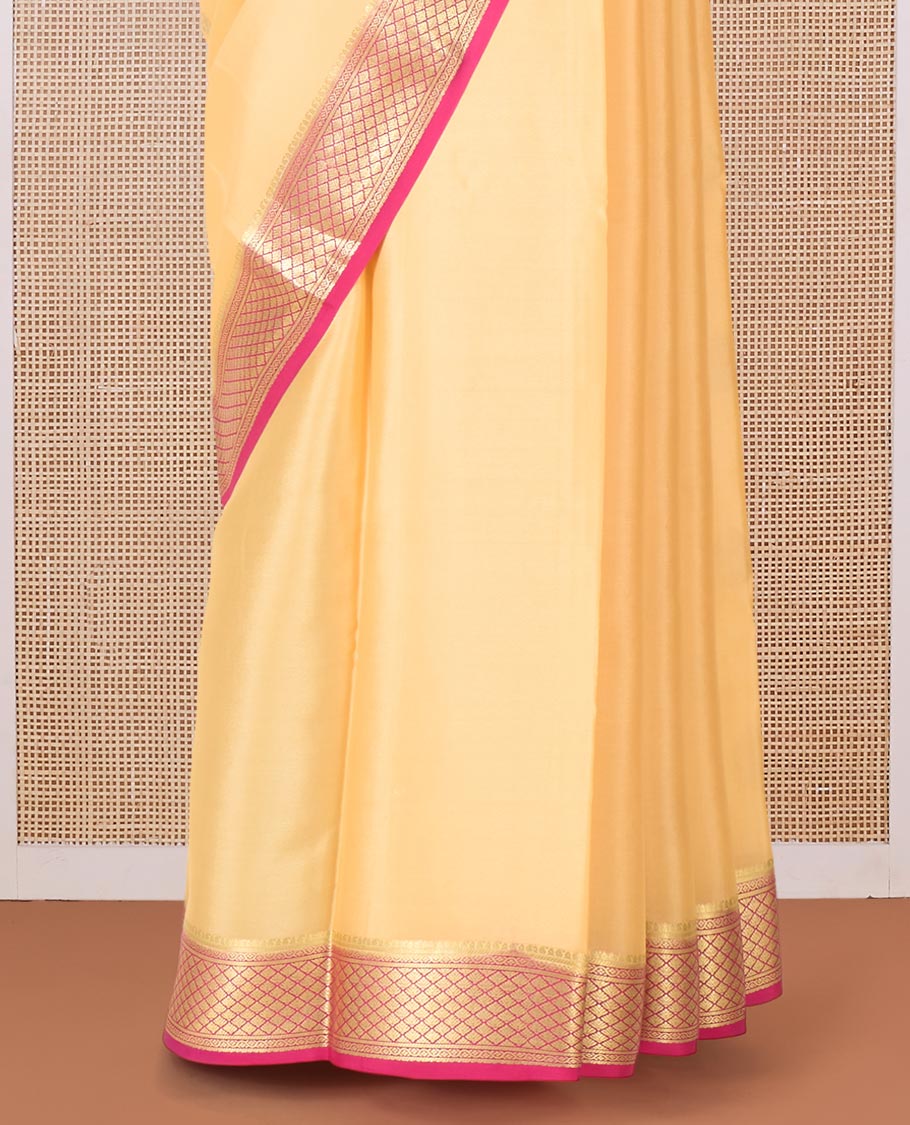 Yellow zari buttas Mysore silk saree, contrast jaal zari border, and pallu of floral creeper design in zari
