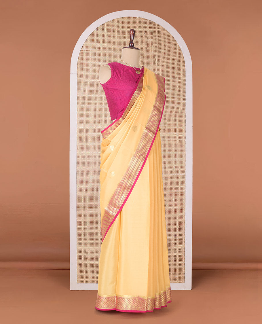 Yellow zari buttas Mysore silk saree, contrast jaal zari border, and pallu of floral creeper design in zari