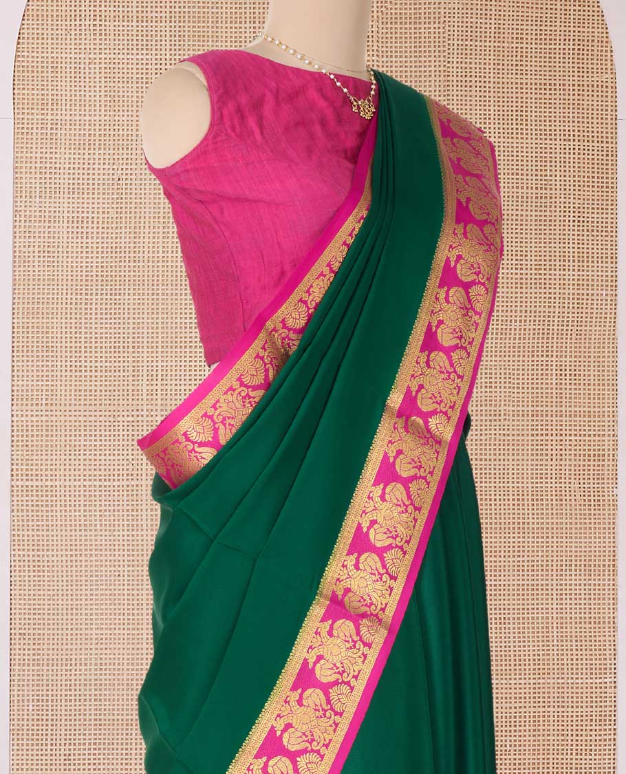 Green plain Mysore silk saree, contrast two-headed eagle border, and pallu of traditional designs