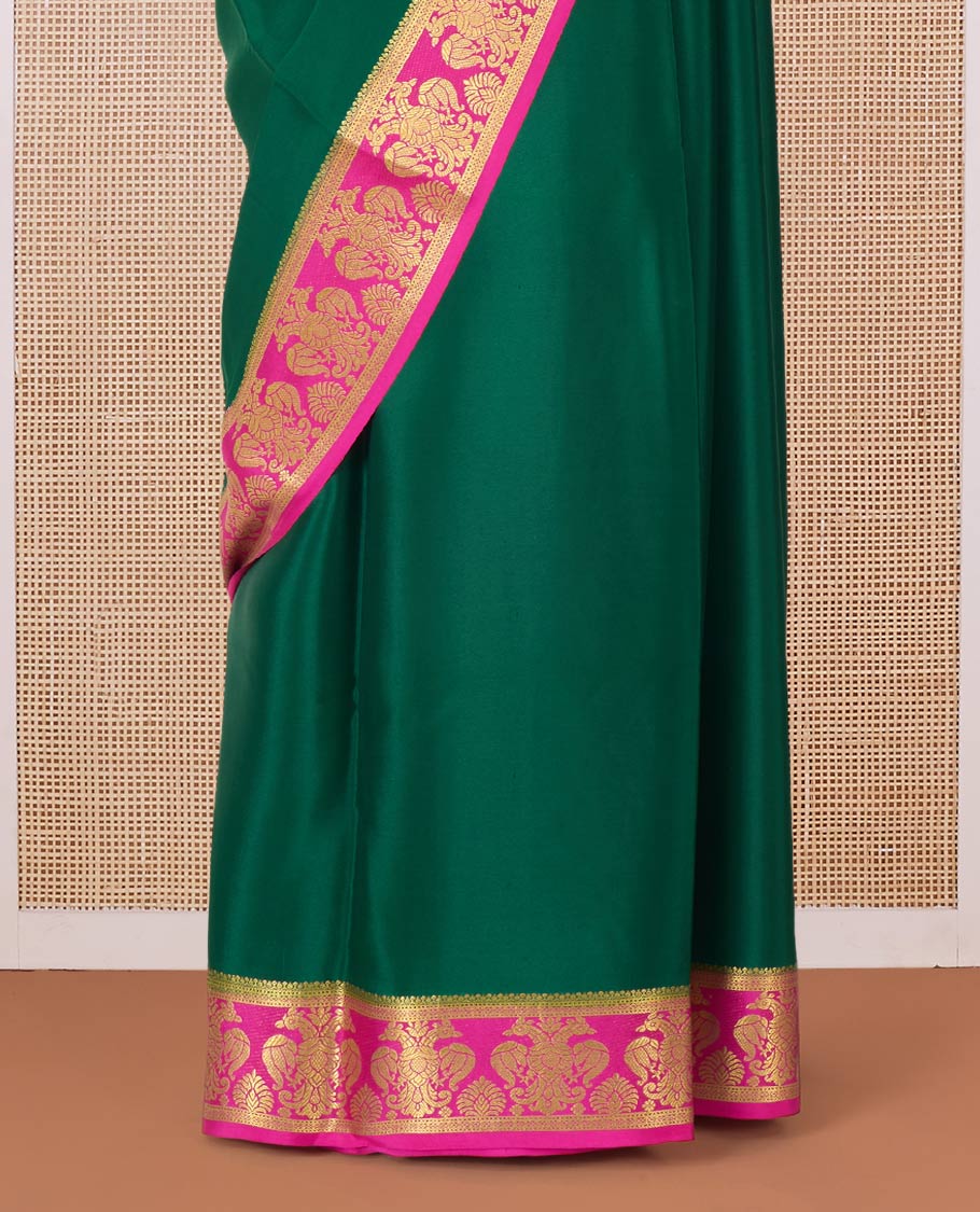 Green plain Mysore silk saree, contrast two-headed eagle border, and pallu of traditional designs