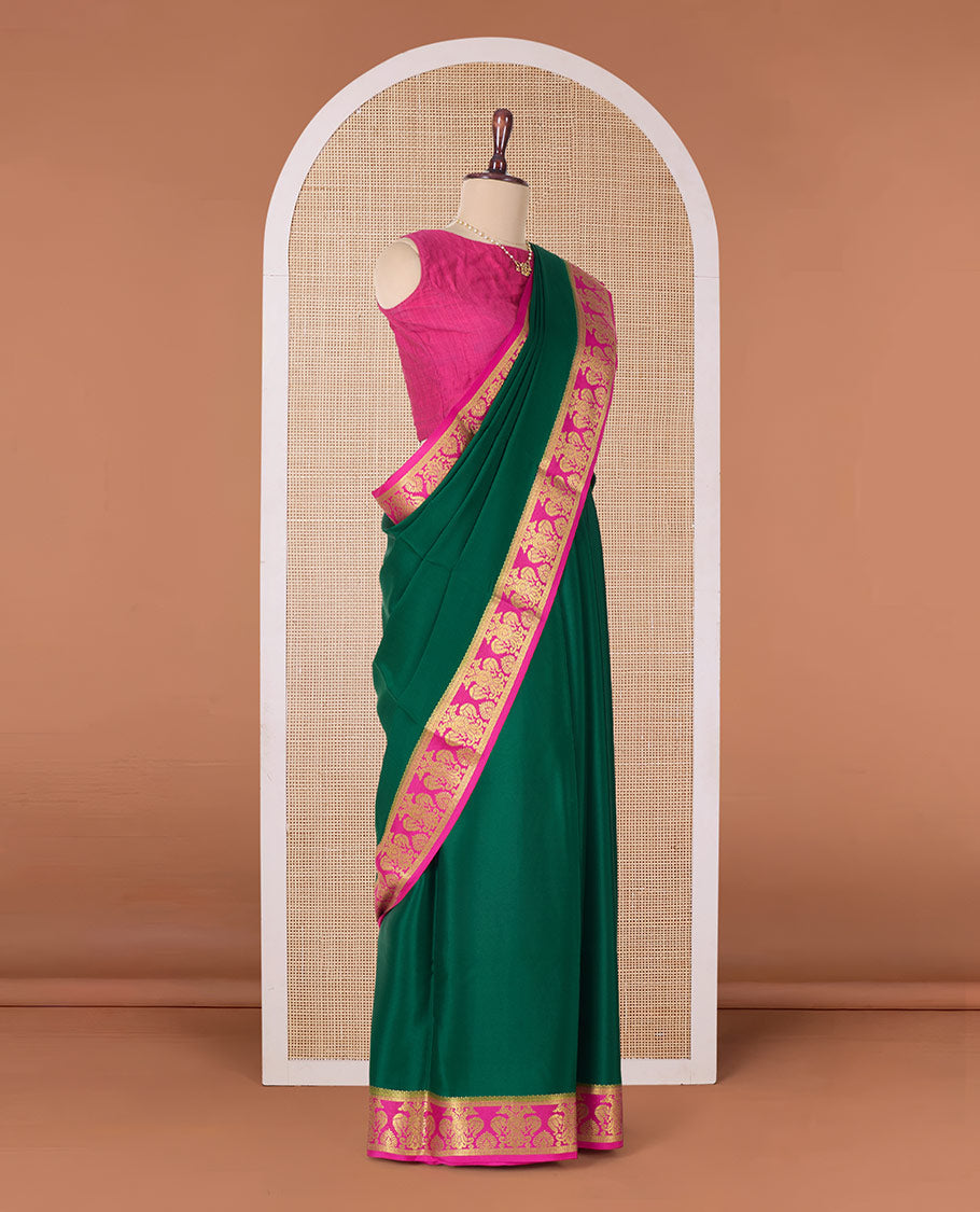 Green plain Mysore silk saree, contrast two-headed eagle border, and pallu of traditional designs