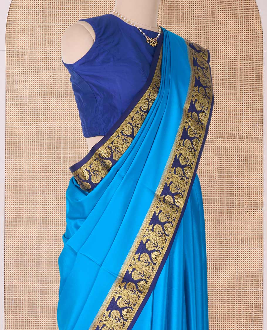 Blue plain Mysore silk saree, contrast two-headed eagle border, and pallu of traditional designs