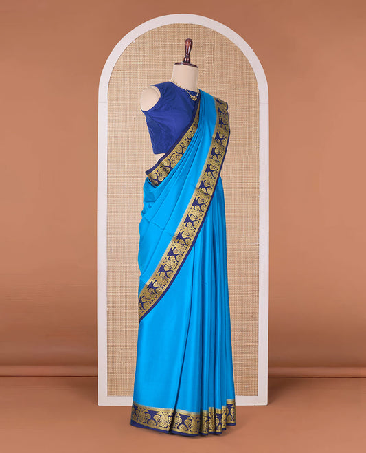 Blue plain Mysore silk saree, contrast two-headed eagle border, and pallu of traditional designs