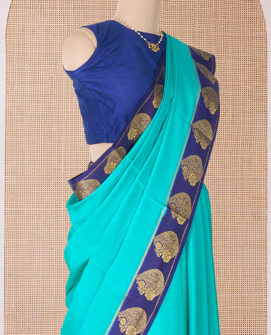 Green plain Mysore silk saree, contrast paisley motifs zari woven border, and pallu of zari stripes