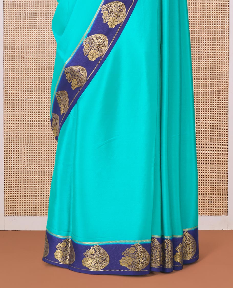 Green plain Mysore silk saree, contrast paisley motifs zari woven border, and pallu of zari stripes