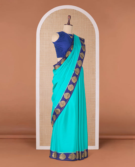 Green plain Mysore silk saree, contrast paisley motifs zari woven border, and pallu of zari stripes