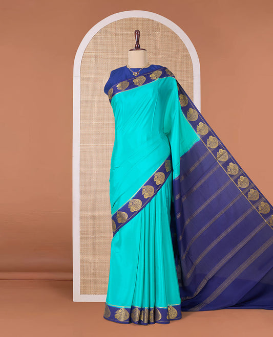 Green plain Mysore silk saree, contrast paisley motifs zari woven border, and pallu of zari stripes