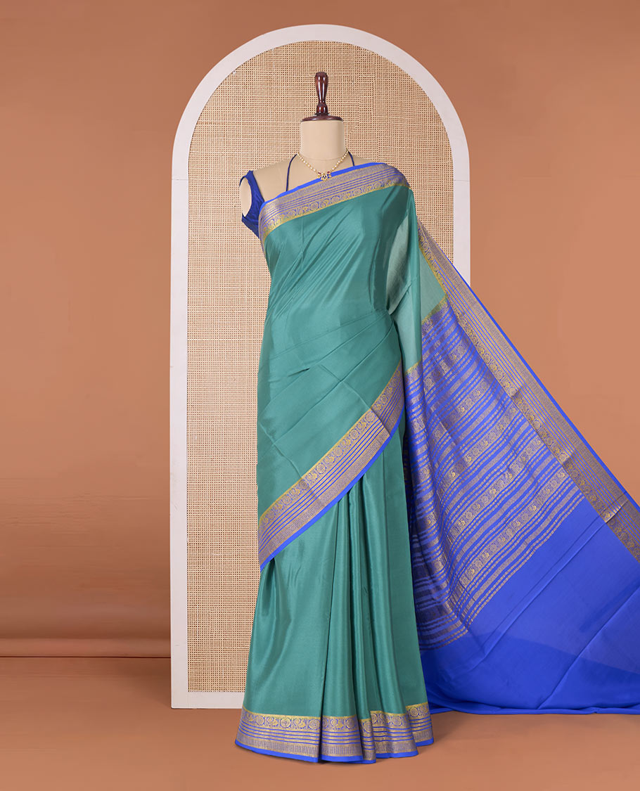 Green plain Mysore silk saree, contrast traditional zari border of Peacock and chakram and pallu of traditional designs