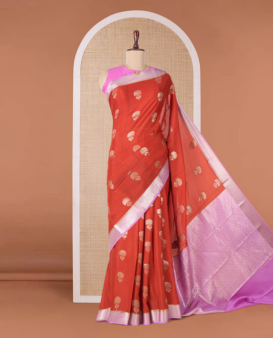 Orange floral buttas Mysore silk saree, contrast traditional zari border, and pallu of jaal design