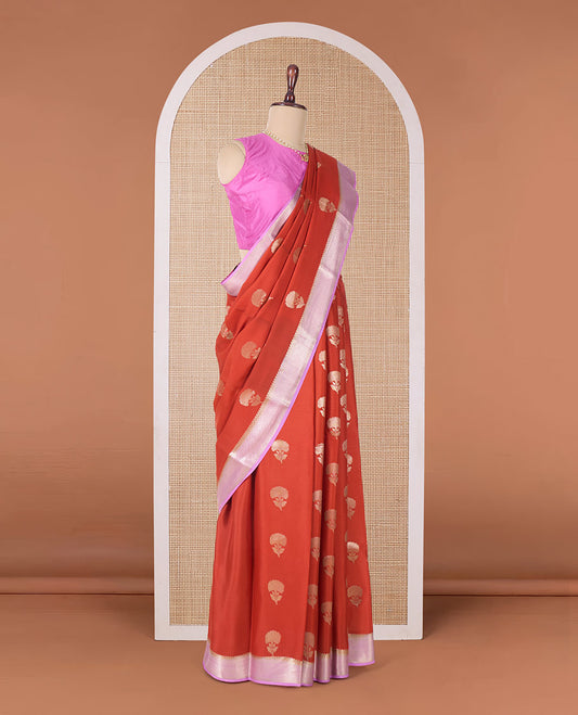 Orange floral buttas Mysore silk saree, contrast traditional zari border, and pallu of jaal design