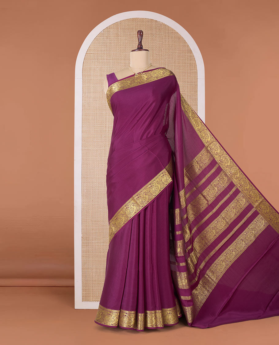 Purple plain Mysore silk saree, traditional zari border of peacocks, and pallu of traditional designs