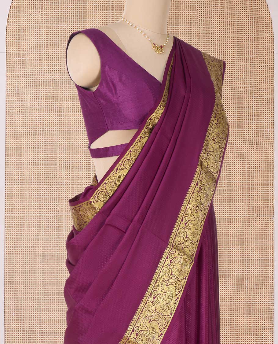 Purple plain Mysore silk saree, traditional zari border of peacocks, and pallu of traditional designs