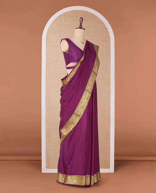Purple plain Mysore silk saree, traditional zari border of peacocks, and pallu of traditional designs
