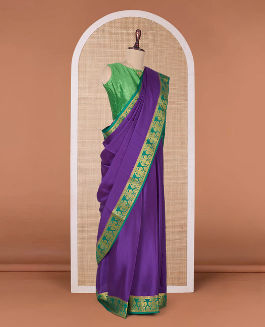 Purple plain Mysore silk saree, contrast two-headed eagle border, and pallu of traditional designs