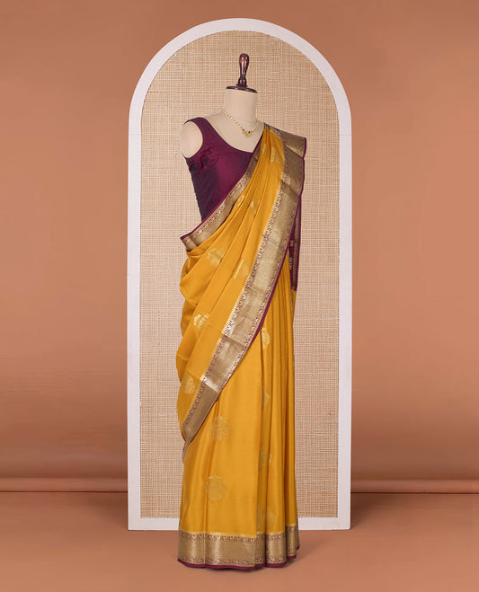 Yellow two-headed eagle motifs zari woven Mysore silk saree, contrast traditional zari border, and pallu of thick zari designs