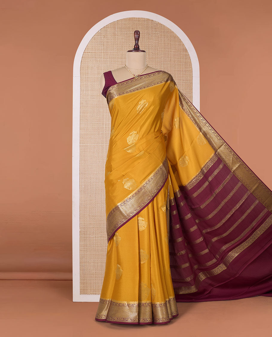 Yellow two-headed eagle motifs zari woven Mysore silk saree, contrast traditional zari border, and pallu of thick zari designs