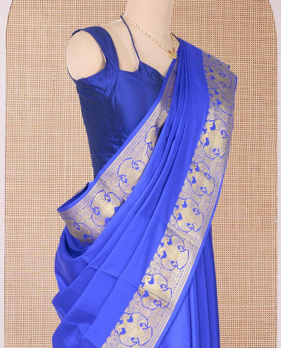 Royal blue plain Mysore silk saree, two-headed eagle border, and pallu of traditional designs