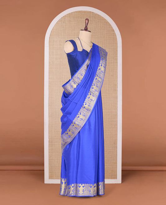 Royal blue plain Mysore silk saree, two-headed eagle border, and pallu of traditional designs