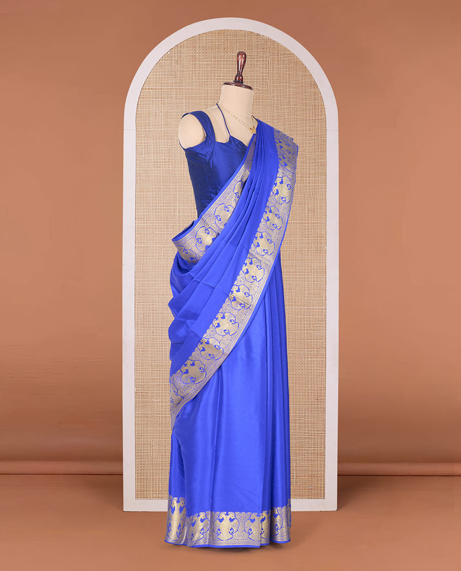 Royal blue plain Mysore silk saree, two-headed eagle border, and pallu of traditional designs