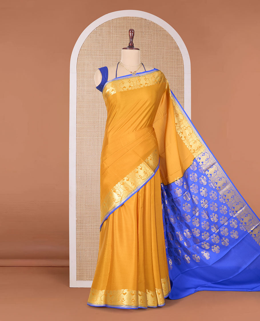 Yellow plain Mysore silk saree, two-headed eagle zari border, and pallu steeped with two-headed eagle motifs