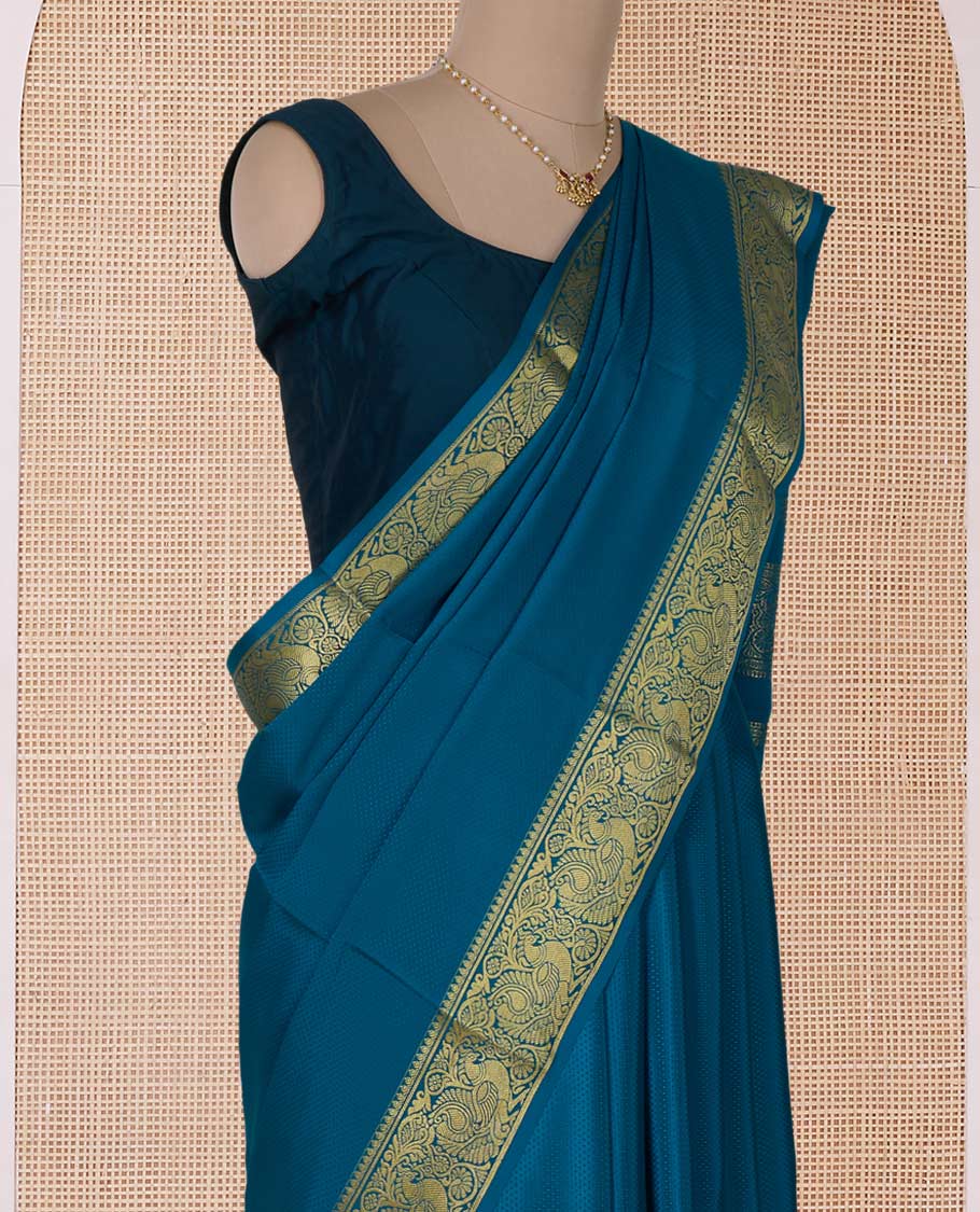 Peacock color embossed Mysore silk saree, traditional peacock motifs zari woven border, and pallu of traditional designs