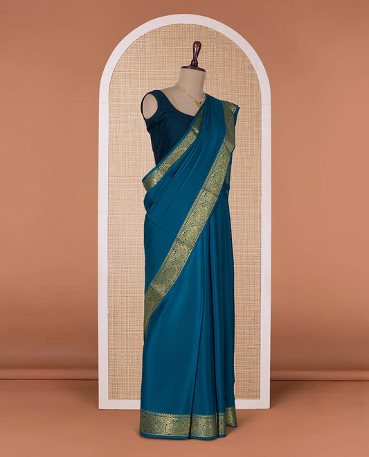 Peacock color embossed Mysore silk saree, traditional peacock motifs zari woven border, and pallu of traditional designs
