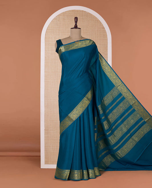 Peacock color embossed Mysore silk saree, traditional peacock motifs zari woven border, and pallu of traditional designs