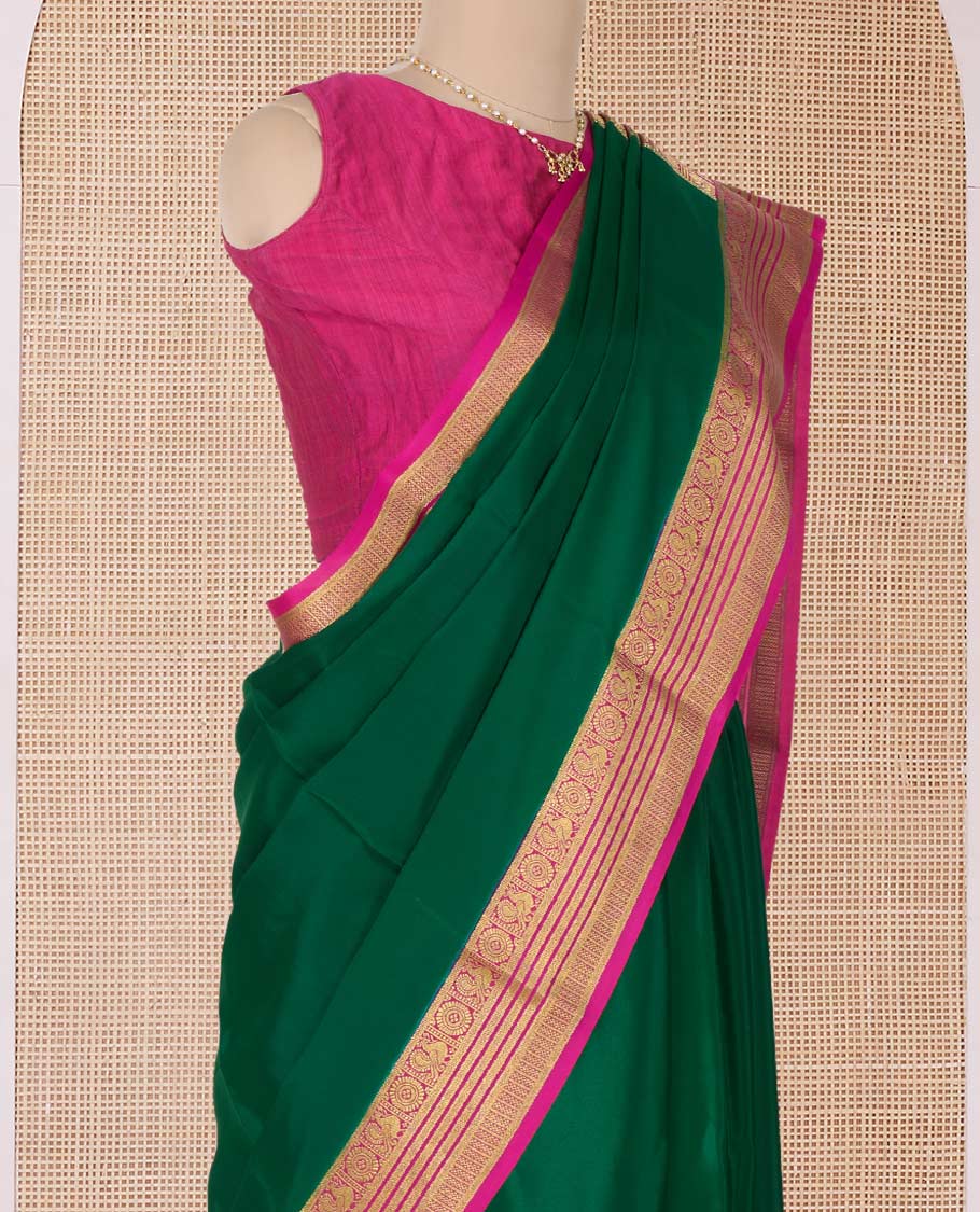 Green plain Mysore silk saree, contrast Peacock and chakram border, and pallu of traditional zari designs