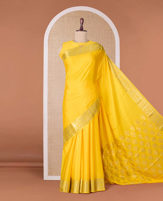 Yellow plain Mysore silk saree, two-headed eagle zari border, and pallu steeped with two-headed eagle motifs