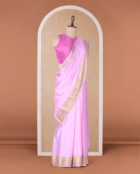 Pink plain Mysore silk saree, two-headed eagle zari border, and pallu steeped with two-headed eagle motifs