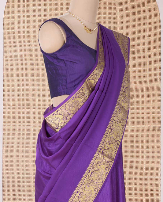 Purple embossed Mysore silk saree, traditional peacock motifs zari woven border, and pallu of traditional designs