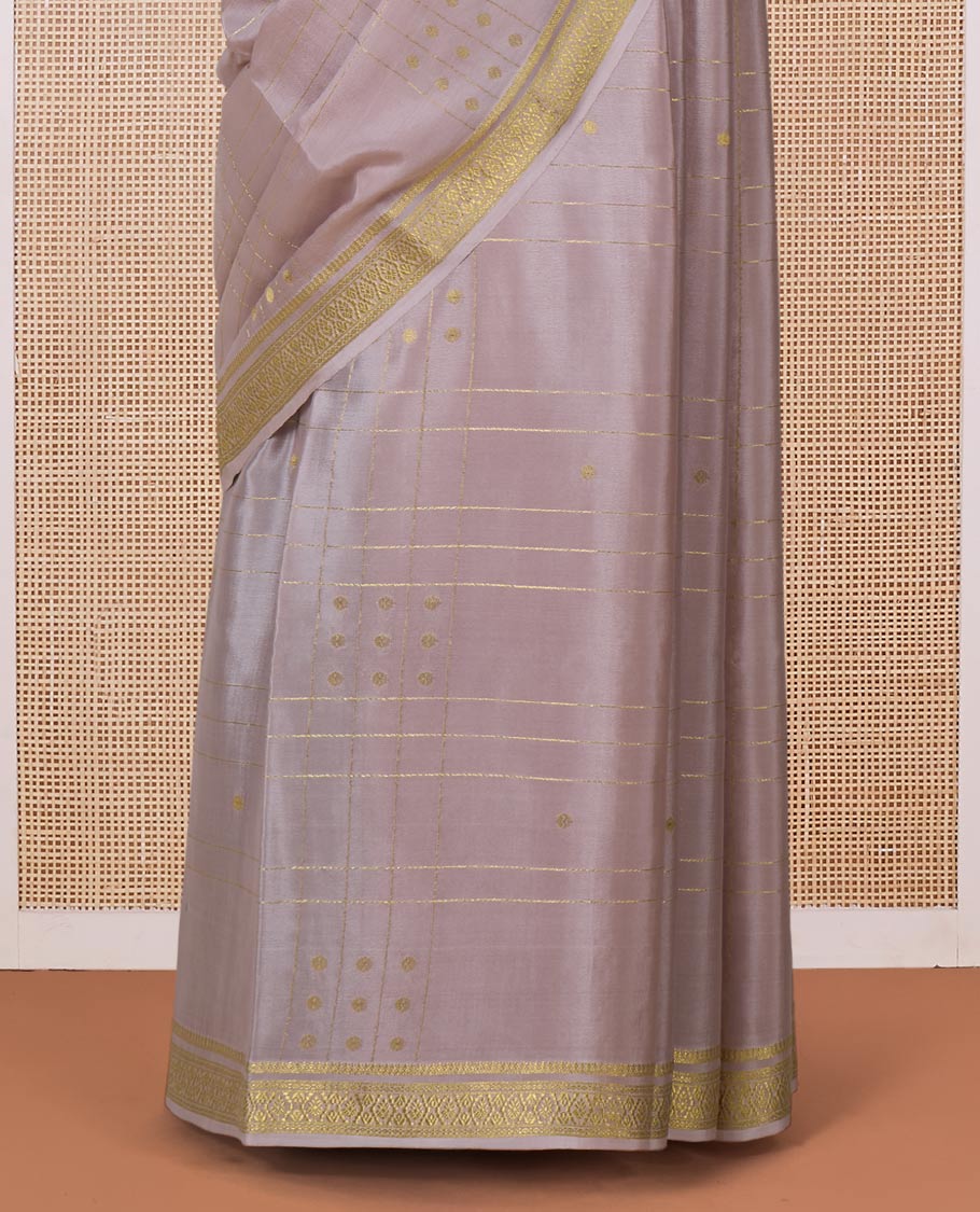 Beige zari buttas and checked Mysore silk saree, traditional zari border, and zari striped pallu