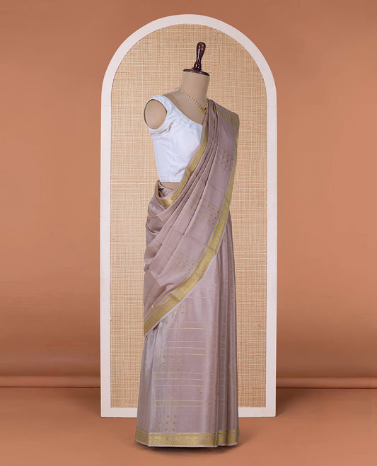 Beige zari buttas and checked Mysore silk saree, traditional zari border, and zari striped pallu