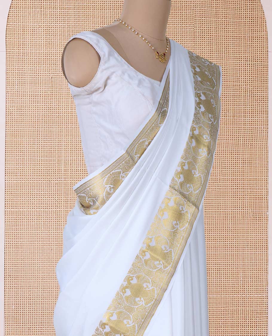 White plain Mysore silk saree, two-headed eagle zari border, and pallu steeped with two-headed eagle motifs