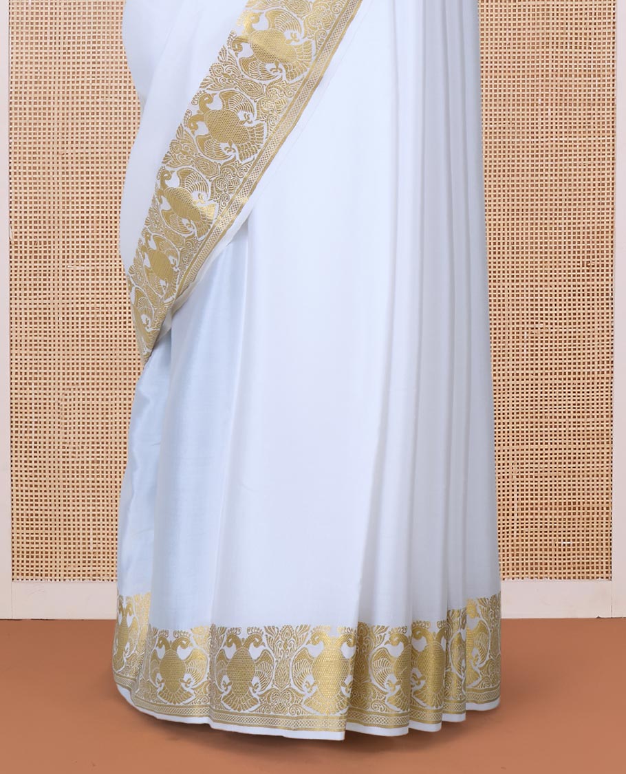 White plain Mysore silk saree, two-headed eagle zari border, and pallu steeped with two-headed eagle motifs