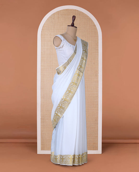 White plain Mysore silk saree, two-headed eagle zari border, and pallu steeped with two-headed eagle motifs