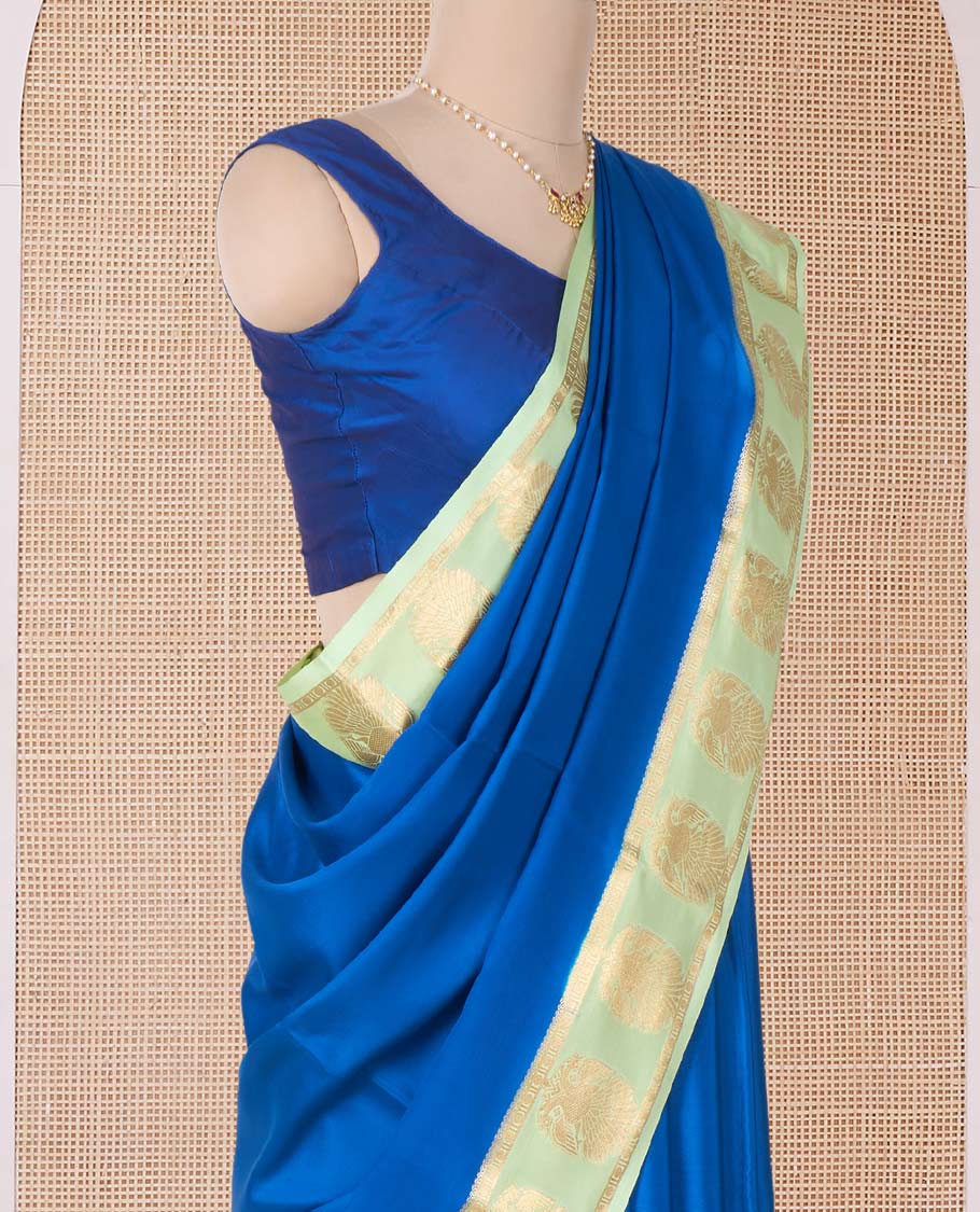 Blue plain Mysore silk saree, contrast two-headed eagle motifs zari woven border, and intricate pallu