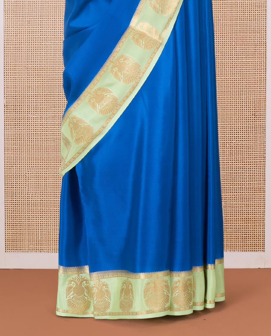 Blue plain Mysore silk saree, contrast two-headed eagle motifs zari woven border, and intricate pallu