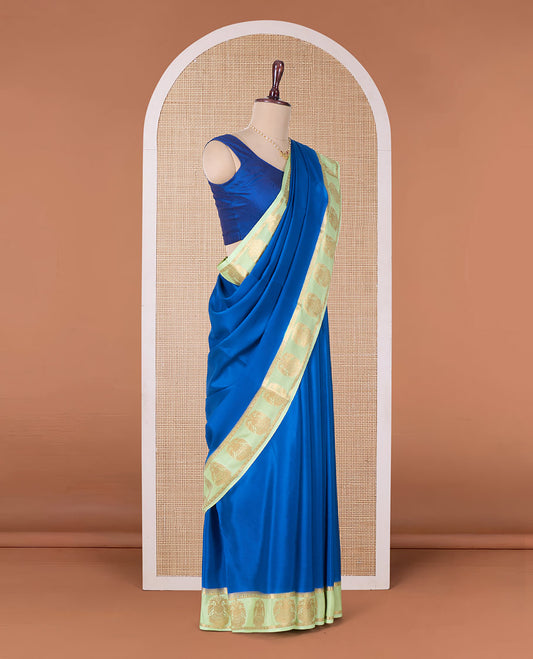Blue plain Mysore silk saree, contrast two-headed eagle motifs zari woven border, and intricate pallu