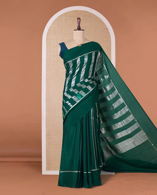 Green peacock, elephant, and floral creeper striped Mysore silk saree, self-border, and pallu of kanchipuram inspired flora-fauna designs