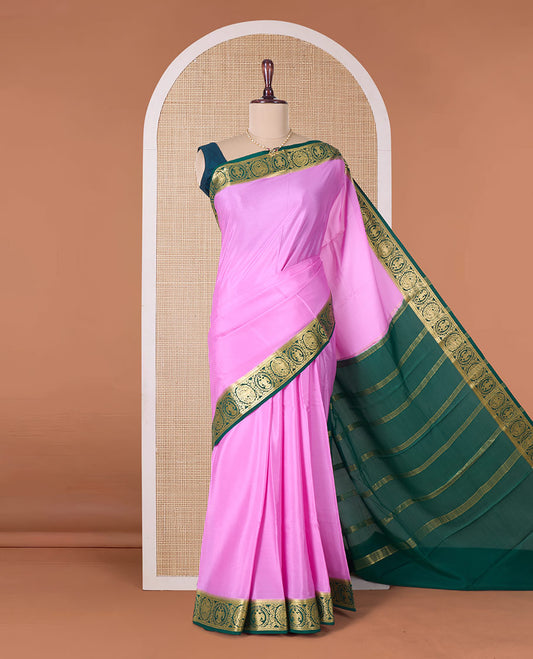 Pink plain Mysore silk saree, contrast border of two-headed eagle, and yaali designs, and zari striped pallu