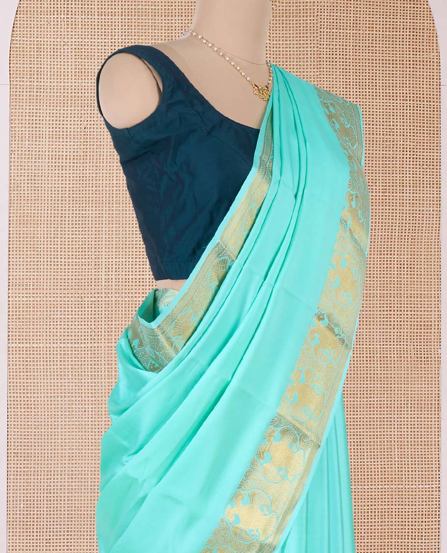 Green plain Mysore silk saree, two-headed eagle motifs zari border, and pallu