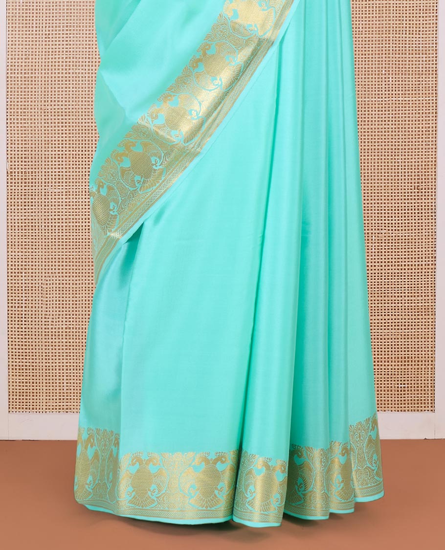 Green plain Mysore silk saree, two-headed eagle motifs zari border, and pallu